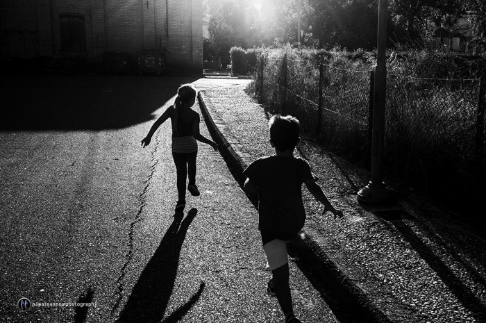 Children running at sunset